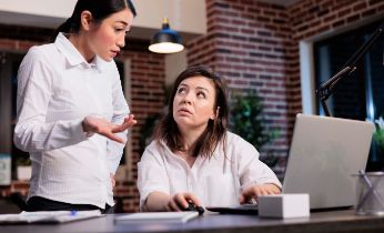 business-company-employees-office-workspace-discussing-about-startup-project-marketing-strategy-multiethnic-corporate-workers-analyzing-management-charts-while-using-laptop 